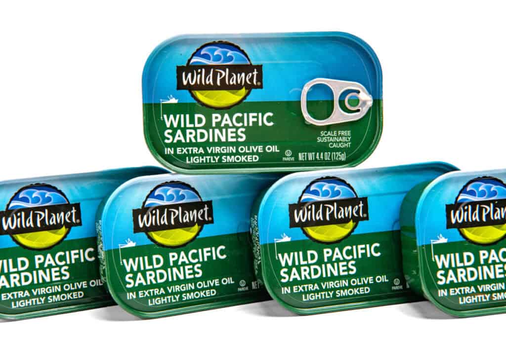wild planet canned sardines in olive oil Canned sardines in olive oil in jars from Wild Planet brand on white background.