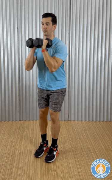 dumbbell reverse lunges with front rack hold exercise demonstration