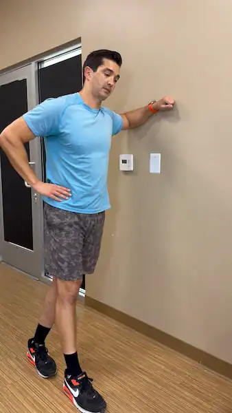 modified side plank on wall demonstration