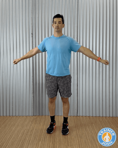 arm swings Trainer Josh demonstrating Arm Swings warm-up exercise