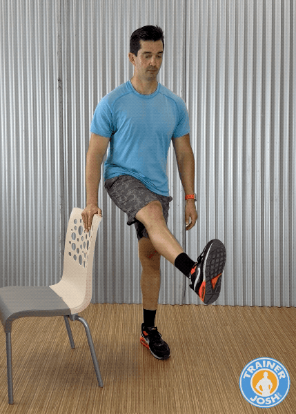 front to back leg swings Trainer Josh demonstrating front-to-back leg swings warm-up exercise