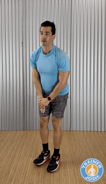 reverse lunge with overhead reach Trainer Josh demonstrating Reverse Lunge with Overhead Reach warm-up exercise